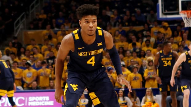 West Virginia guard Deuce McBride staring down at Pitt defender inside the Peterson Events Center.